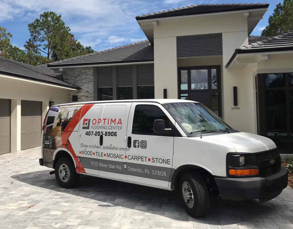 Professional tile installation process with large porcelain pavers, adhesive mortar, and leveling spacers